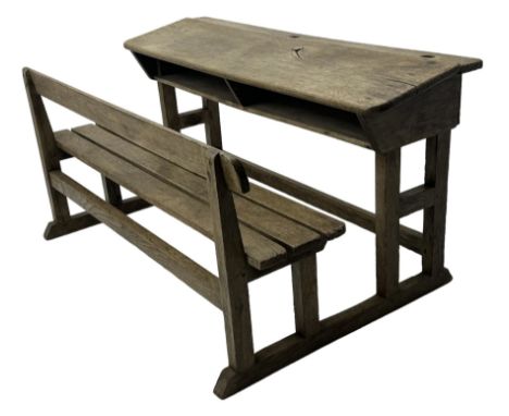 Victorian child's pine double school desk, the writing surface with two inkwells and two shelves underneath, integrated slatt