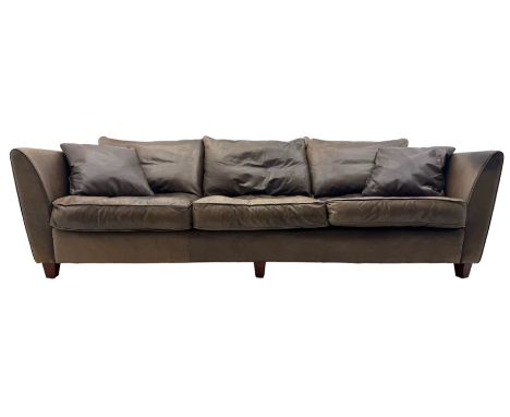 Collins & Hayes - contemporary grande three-seater sofa upholstered in brown leather, with curved arms and standing on taperi