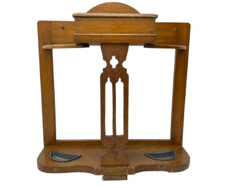 Arts & Crafts period golden oak hallstand, central glove compartment with moulded hinged top, over a Gothic pierced splat, fl