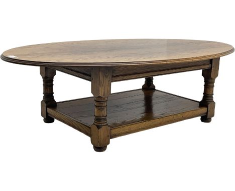 Traditional oak coffee table, moulded oval top, four turned pillar supports united by undertierDimensions: Height:&nbsp;45cm&