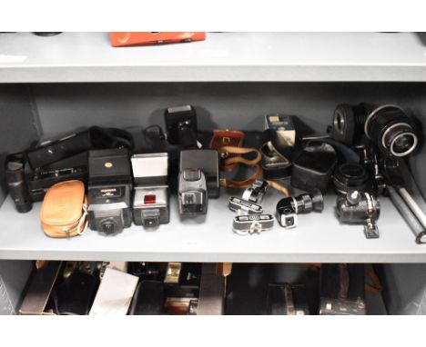 A selection of camera accessories including Olympus OM Motor Drive 2, Mamiya grip, Sunpack grip/flash, Ilford Cobra D650, Jes