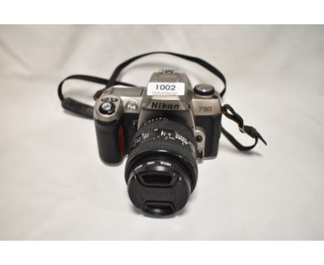 A Nikon F80 camera with Nikon AF Nikkor 28-70mm 1:3,5-4,5D lens