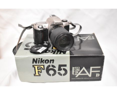 A Nikon F65 camera with Nikon AF Nikkor 28-80mm 1:3,5-4,6D lens