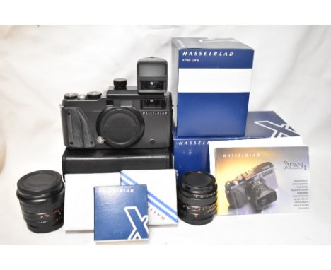 A Hasselblad Xpan II system with camera body, Xpan F4/45mm lens, XPan F5,6 30mm lens, a 30mm viewfinder flash, lens shade, fi