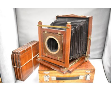 A mahogany plate camera in box with three film holders (no lens)