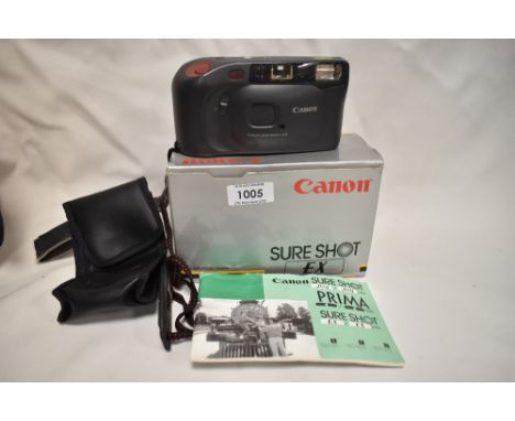 A Canon Sure Shot EX camera with canon 35mm 1:4,5 lens in original box