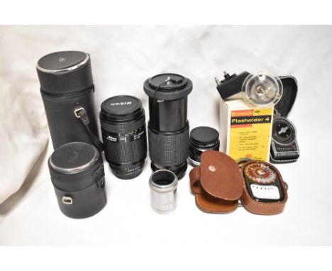 A selection of lenses, light metres etc. A Sunagor CDX 80-200 f4,5 lens, a Nikon AF Nikkor 70-210mm 1:4-5,6 lens a Fuji 1:1,8