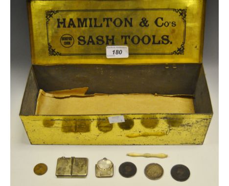 A silver envelope stamp case, Birmingham 1921;  an EPNS stamp box holder;  a bone needle holder;  a Hamilton & Co Sash tools 