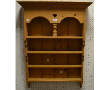 A contemporary  pine wall shelf, stepped cornice, alcove over three shelves. 85cm high x 69cm wide x 20cm deep.