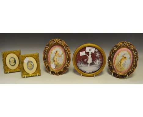 A pair of Continental porcelain ceramic plaques, painted and gilded with cherubs, gilt frame; a pair of Wedgwood Jasperware f