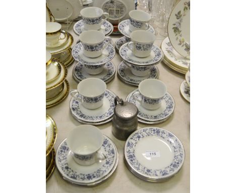 A hard paste porcelain tea service for eleven, decorated in blue and white floral motifs; a 19th century hammered pewter, tan