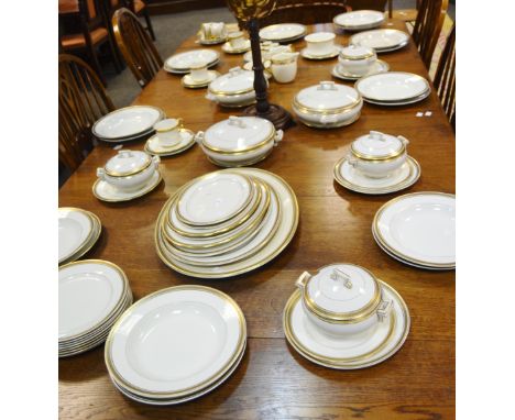 A comprehensive Cauldon dinner service, gold Greek key pattern,  comprising of a graduated set of serving plates, soup dishes