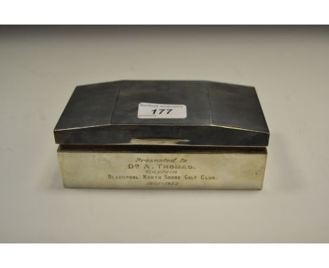 A silver canted rectangular cigarette box ,cedar lined, engine turned, Birmingham 1951