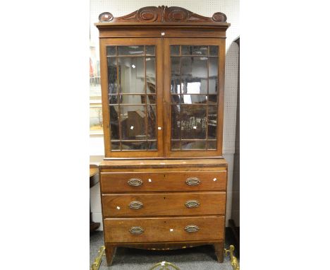 A late Georgian chest of drawers with separate display cabinet, carved acanthus scrolled stepped cornice above glazed doors e