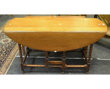 An early 20th century long gate leg dropleaf dining table c.1940 (1)