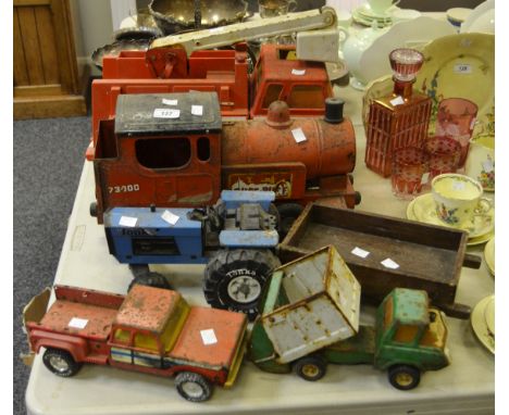 A Triang tin plate puff puff train (playworn); a Tonka light and power company mobile unit; a Tonka tin plate blue tractor (p