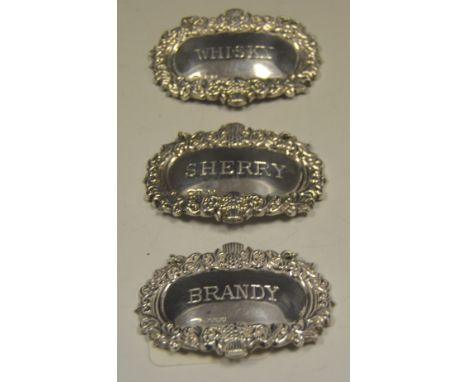 A silver decanter label, Whisky;  others, Sherry, Brandy