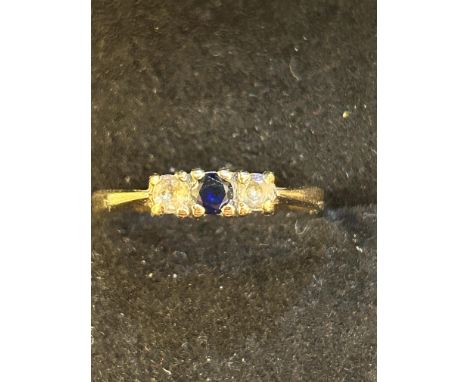 9ct Gold dress ring set with central sapphire & 2 white stones Size K 