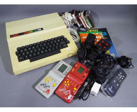 Mettoy - Dragon 32 - A vintage Dragon 32 computer with 2 x controllers, a power lead and 5 x cassettes. Also comes with 2 x h