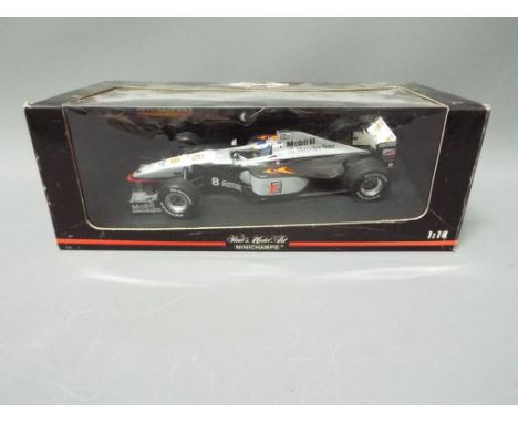 Minichamps - A boxed 1:18 scale Minichamps # 530981808 McLaren MP4/13 'M.Hakkinen' Formula 1 Racing Car. The model appears Ne