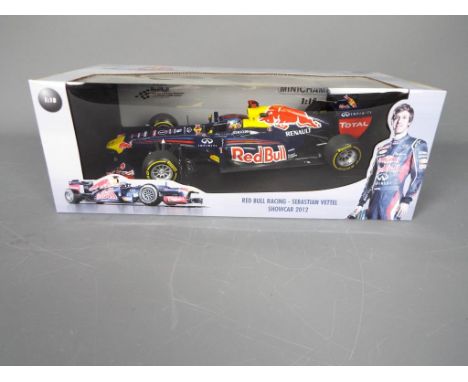 Minichamps - A boxed Minichamps #110120071 Limited Edition 1:18 scale Red Bull Racing Showcar 2012 'Sebastian Vettel'. The mo