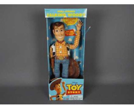 Thinkway Toys - Disney - A boxed pull string talking Sheriff Woody doll from Toy Story. # 62943. He is still wired into the p