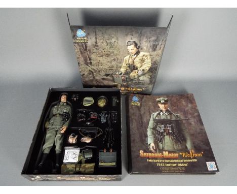 DiD - A boxed 1:6 scale WW2 action figure 'Sergeant-Major Wolfram' by DiD. The high quality  figure complete with a range of 