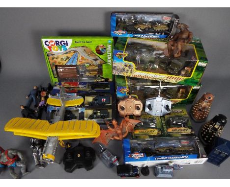 Corgi, Teamster,Others -  A mixed lot of diecast and action figures. Lot includes eight boxed military diecast sets / models 