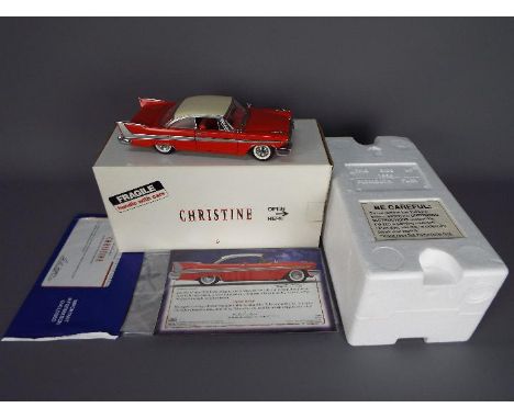 Danbury Mint - A boxed Danbury Mint 1:24 scale 1958 Plymouth Fury 'Christine' . The model in red with white roof appears to b