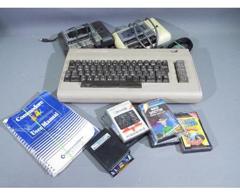 Commodore - A Commodore 64 system with keyboard, 2 x Datasette units, an instruction manual and 6 x cassettes. The items are 
