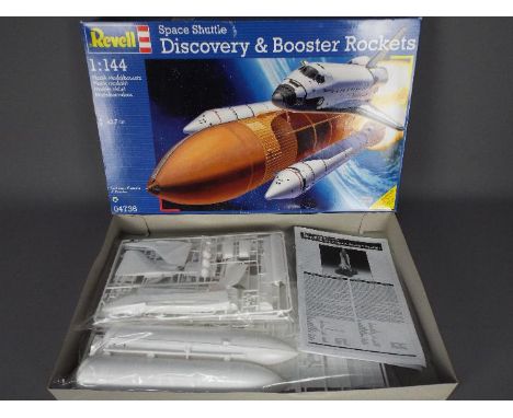 Revell - A boxed Revell 1:144 scale #04736 Space Shuttle Discovery &amp; Booster Rockets plastic model kit. The kit appears t