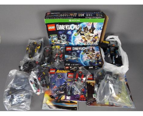 Lego - A collection of unboxed Lego Batman related cars and figures including # 6860, a Batmobile, The Jokers Helicopter and 