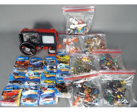 Hot Wheels, Tomy, Corgi, Britains, Matchbox, Others - A mixed collection of diecast, diecast accessories and an unboxed vinta