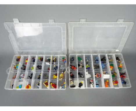 Lego - A collection of 56 x Lego figures including Batman, Robin Hood, Wonder Woman and similar. They all appear in Good cond