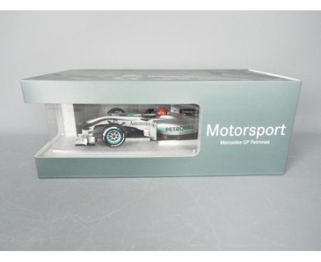 Minichamps - A boxed 1:18 scale Minichamps #B66960091 Mercedes GP Petronas MGP W01 Formula 1 Racing Car 2010 'Michael Schumac