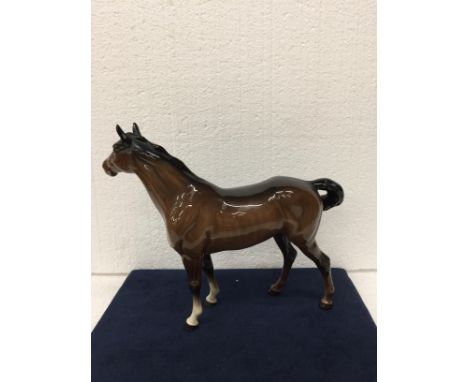 A VINTAGE BESWICK GLOSS BAY HORSE WITH WHITE BLAZE AND A BLACK TAIL AND MANE AND TWO FRONT WHITE SOCKS AND SWISH TAIL - 21.75