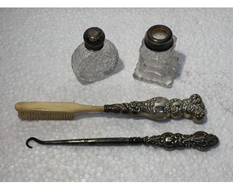 A VINTAGE HALLMARKED BIRMINGHAM AND STERLING SILVER BUTTON HOOK, BRUSH, PERFUME TOP AND CONDIMENT RIM 