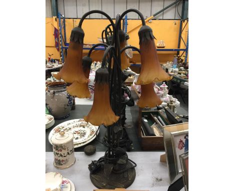 AN ART NOUVEAU STYLE TABLE LAMP WITH SIX BRANCHES AND AMBER GLASS SHADES - WORKING AT TIME OF CATALOGUING, HEIGHT 65CM 