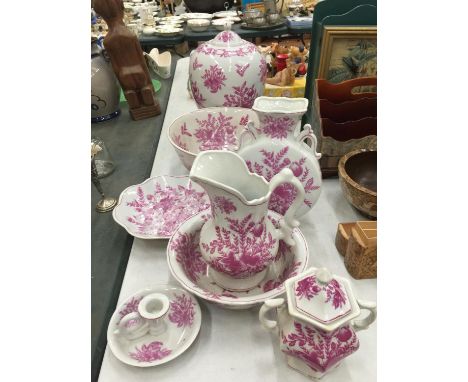A PINK AND WHITE FLORAL PATTERN BATHROOM SET TO INCLUDE JUG AND BOWL, CANDLESTICK, LARGE BOWL, LARGE LIDDED JAR, ETC 