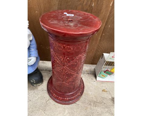 A LARGE RED CERAMIC JARDINAIRE STAND 