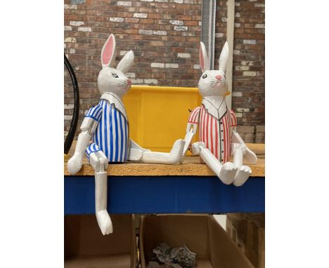 A PAIR OF SHELF RABBITS WITH STRIPED JACKETS HEIGHT 46CM 