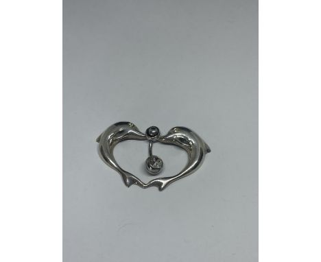 A MARKED SILVER BELLY BUTTON BAR WITH A DOLPHIN DESIGN 