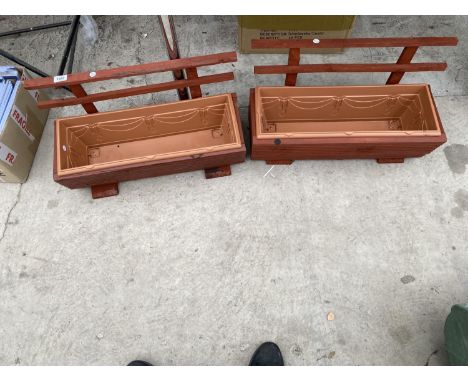 A PAIR OF WOODEN TROUGH PLANTERS WITH PLASTIC INSERTS 