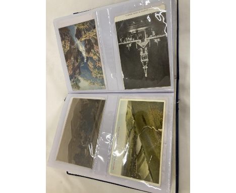 AN ALBUM OF ANTIQUE AND VINTAGE POSTCARDS - APPROX 180 