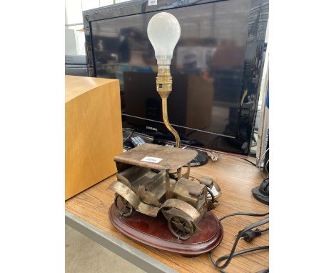 A DECORATIVE TABLE LAMP WITH VINTAGE CAR DESING 