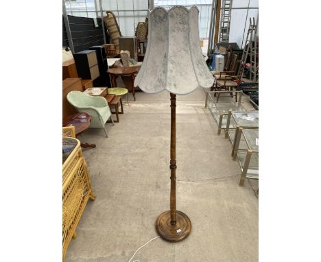 A BEECH STANDARD LAMP ON TURNED COLUMN COMPLETE WITH SHADE 