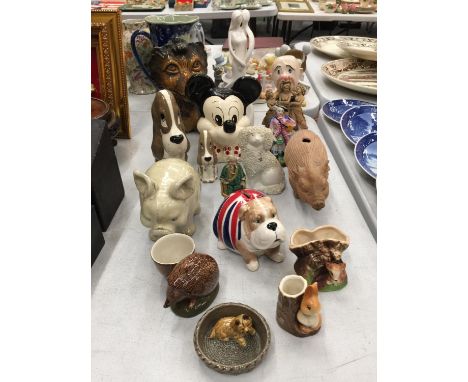 A QUANTITY OF CERAMIC ITEMS TO INCLUDE PIGS, MICKEY MOUSE, DOGS, MONEY BOXES, ETC 