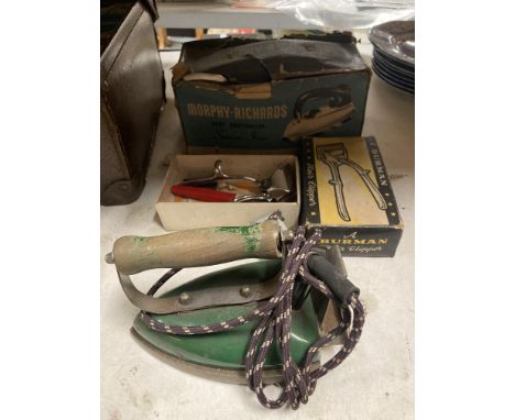 A BOXED VINTAGE MORPHY RICHARDS IRON, BOXED BURMAN HAIR CLIPPERS AND A VINTAGE ELECTRIC IRON WITH WOODEN HANDLE 