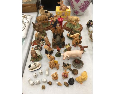 A LARGE QUANTITY OF CERAMIC AND RESIN ANIMAL FIGURES TO INCLUDE PIGGIN', LEONARDO MODELS OF COWS AND CALVES ON BASES, BIRDS, 