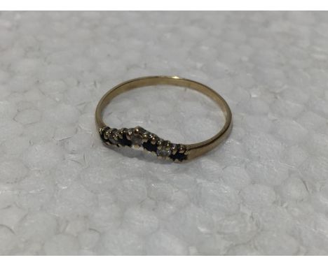 A 9CT GOLD WISHBONE RING WITH SAPPHIRES AND CUBIC ZIRCONIA STONES 